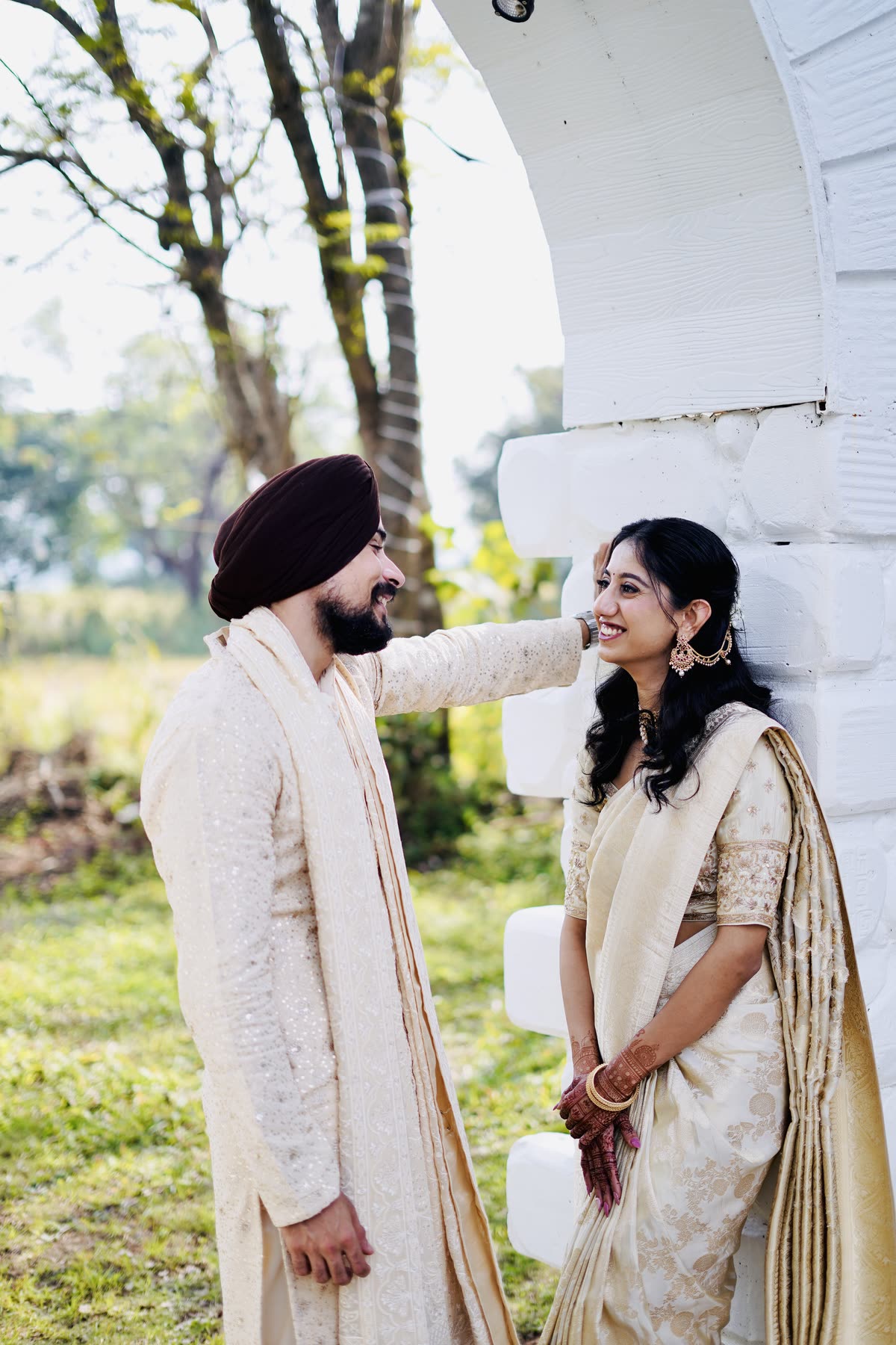 He tucks her hair back and she laughs