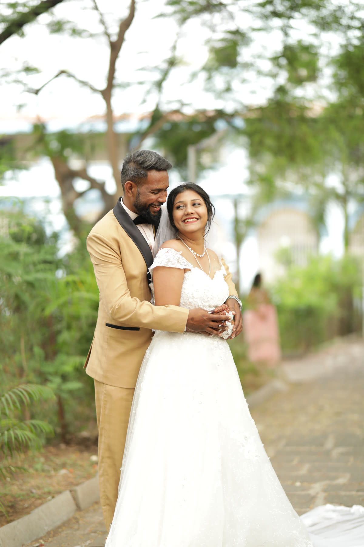 Held close by the water in a full gown