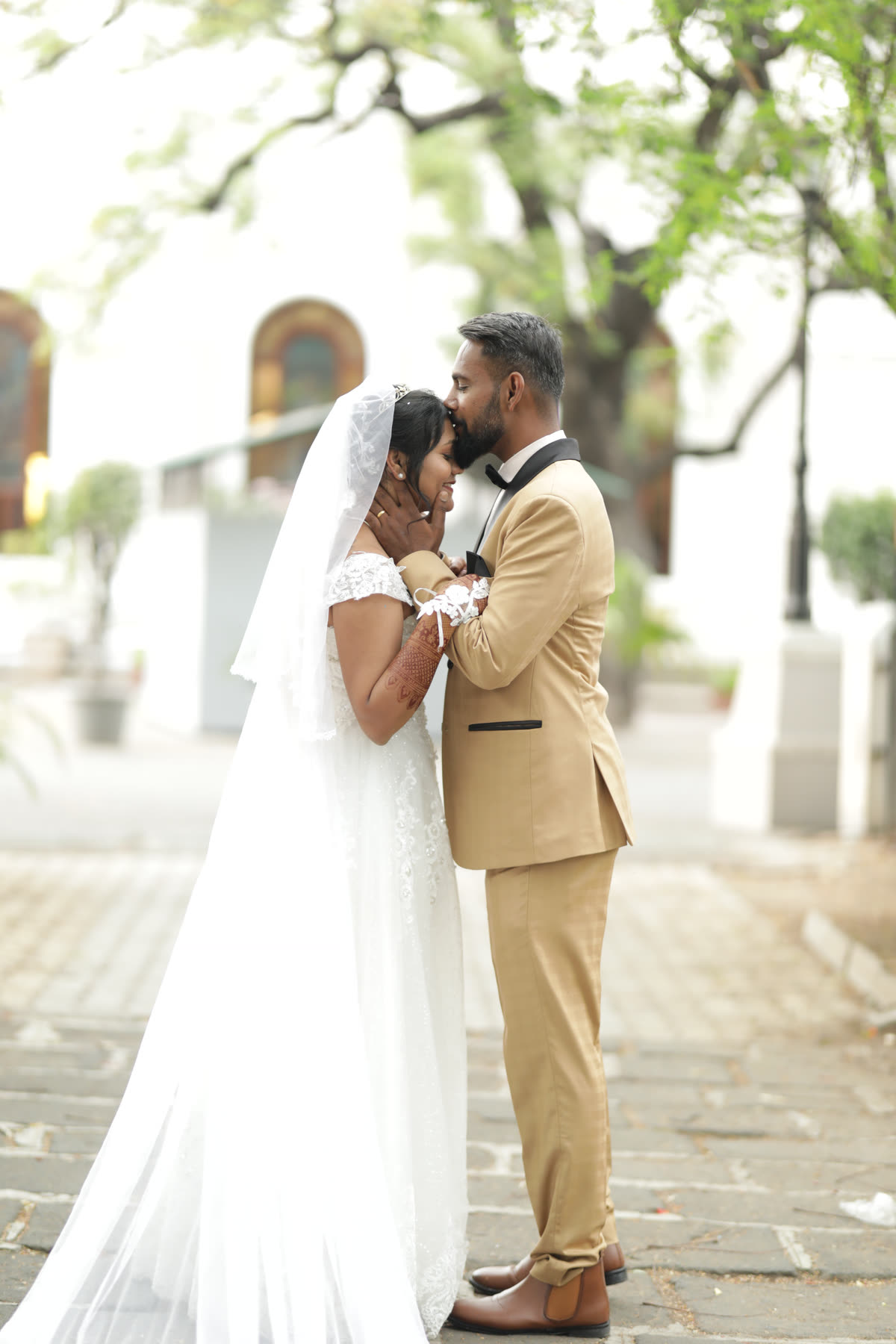 Forehead to forehead outside the church